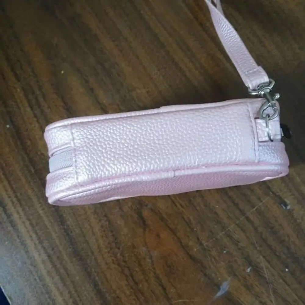 7-day pill organizer designed for use twice daily, w/ pink leather bag